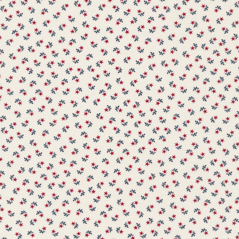 White fabric swatch with tiny, ditsy, red stars paired with navy blue leaf sprigs