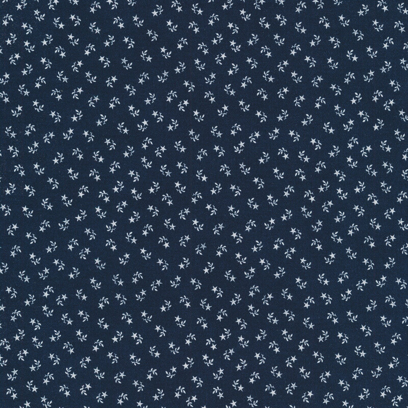 Navy blue fabric swatch with tiny, ditsy, white stars and leaf sprigs paired together