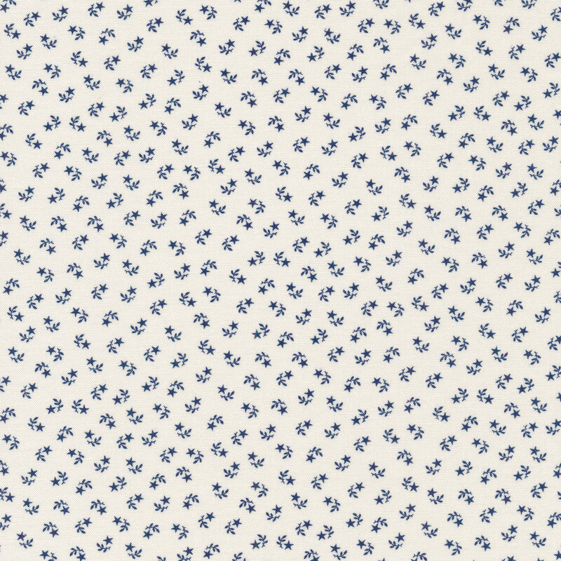 White fabric swatch with tiny, ditsy, navy stars and leaf sprigs paired together