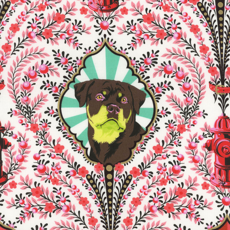 Fabric with damask dog portraits and fire hydrants with intricate pink hued floral designs against a cream background