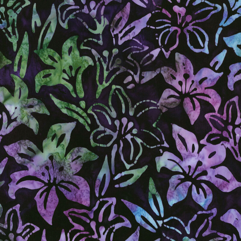 fabric featuring mottled green, purple and blue lily flowers with a dark purple background