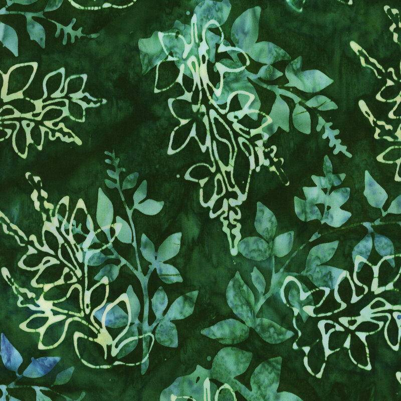 This fabric features layers of mottled green and blue branches with a dark green mottled background.