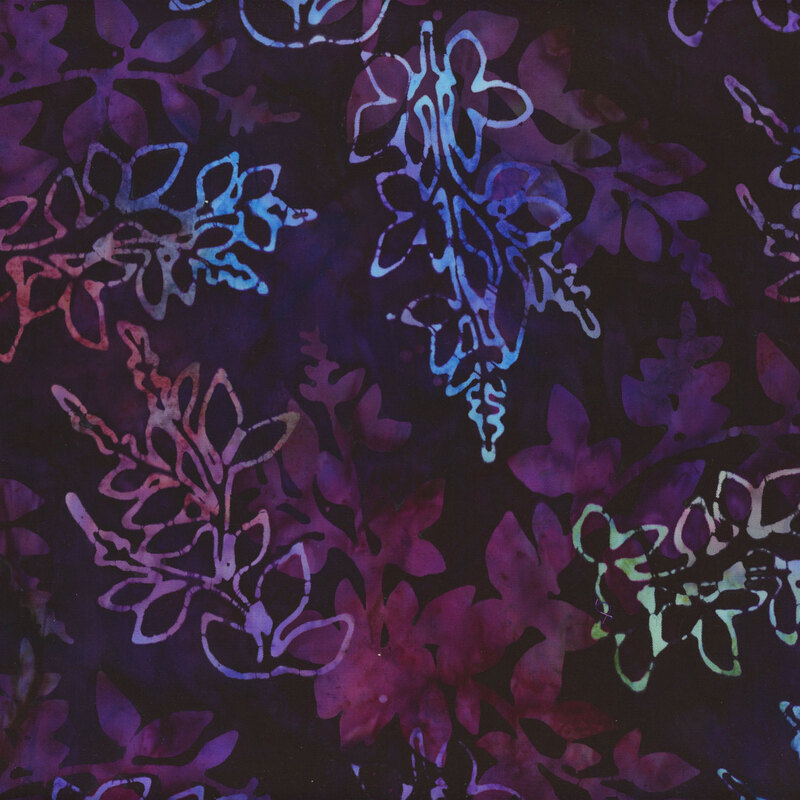 This fabric features layers of mottled green, pink and blue branches with a very dark purple mottled background.