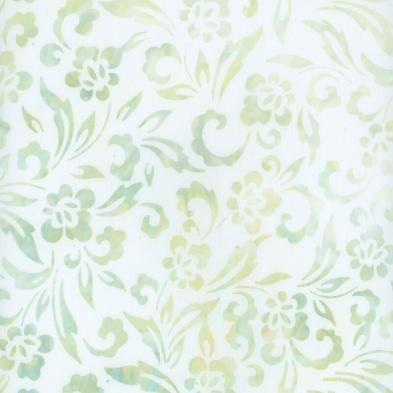 this fabric features mottled green and aqua blue flowers, scrolls and leaves on a mint green background