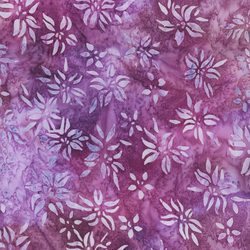This fabric features light  periwinkle blue mottled flowers with a dark magenta purple mottled background.