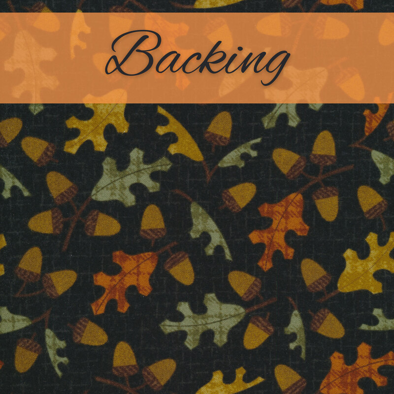 Black flannel fabric with tossed orange, yellow, and green oak leaves with brown acorns and an orange banner at the top that reads 