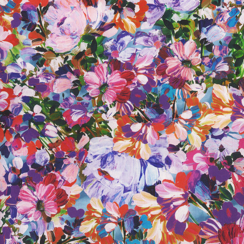 Scan of fabric featuring variously-colored flowers and petals on a foggy blue background