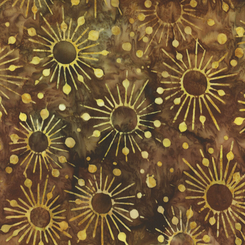Earth tone brown mottled batik fabric with lighter yellow starbursts and dots all over