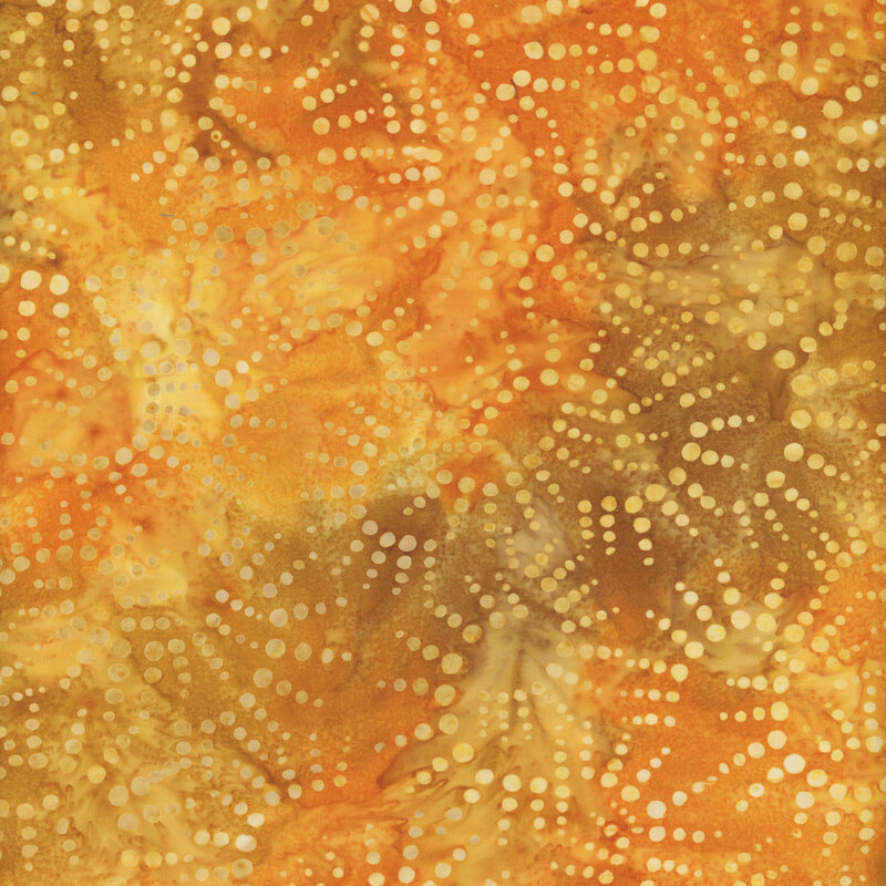 Mottled golden yellow, orange, and brown fabric with dotted golden yellow half sun shapes all over
