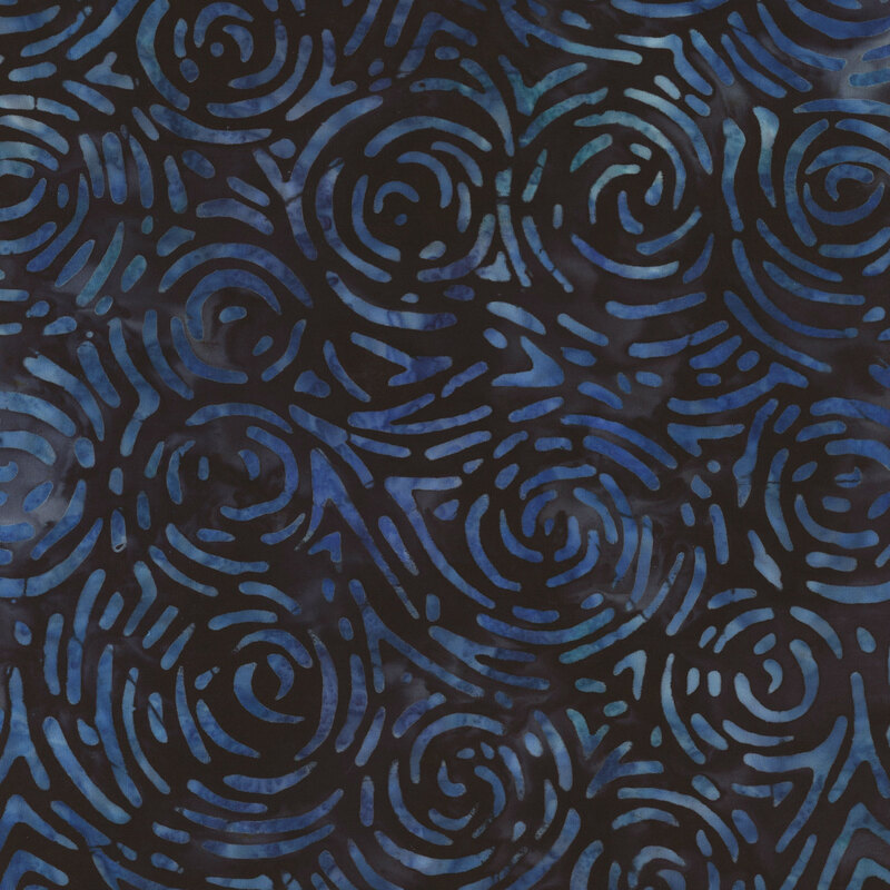 Dark navy blue batik fabric with lighter blue broken swirl shapes all over