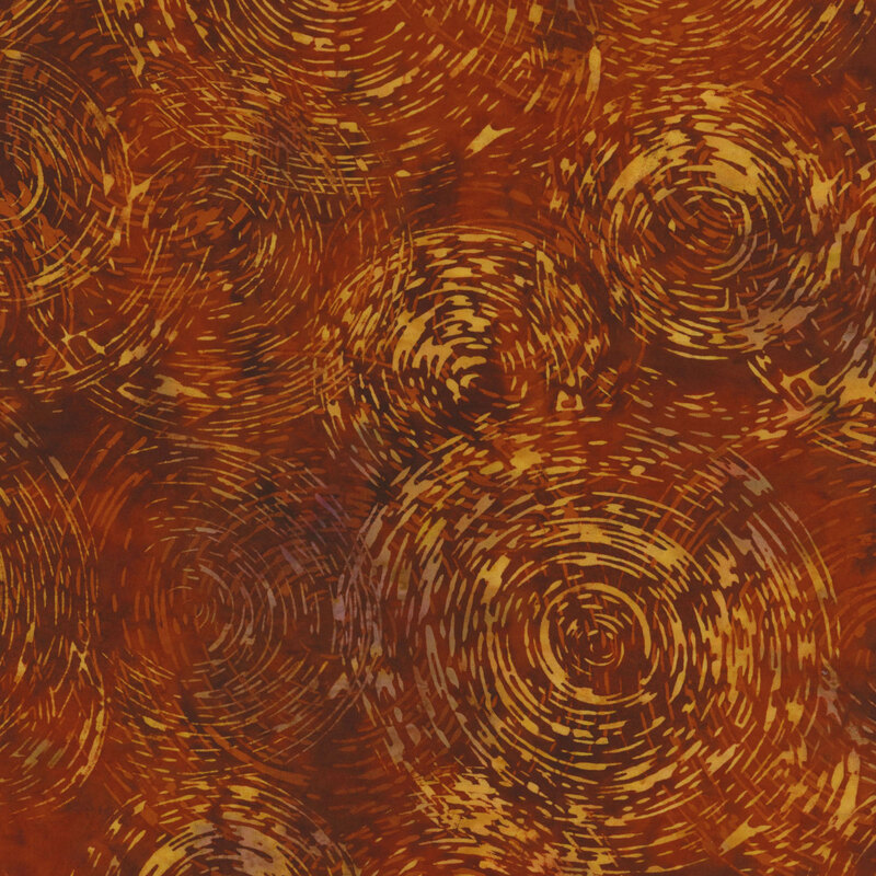 Brown mottled fabric with imprecise concentric circles in a golden yellow color