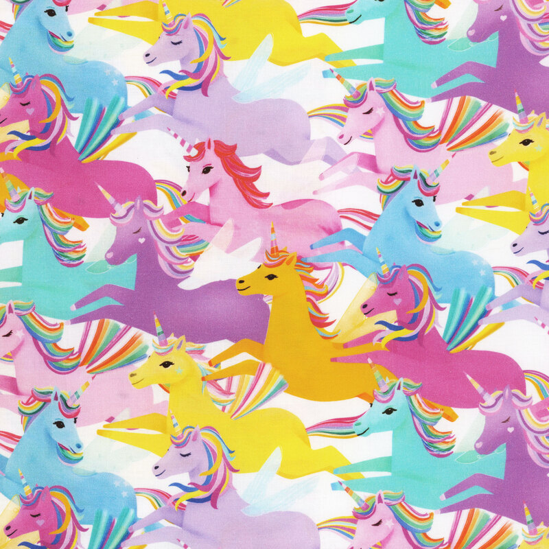 fabric with multicolored unicorns galloping across a white background