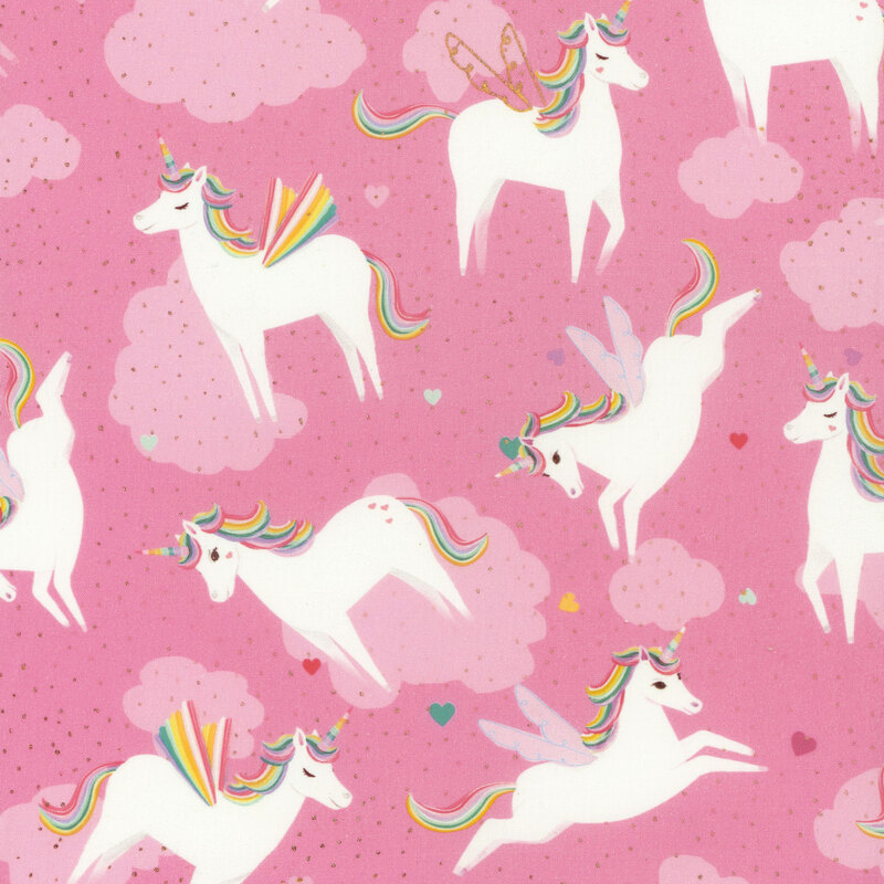 fabric with leaping winged unicorns on a pink background with clouds and tossed multicolored hearts, all with gold accents
