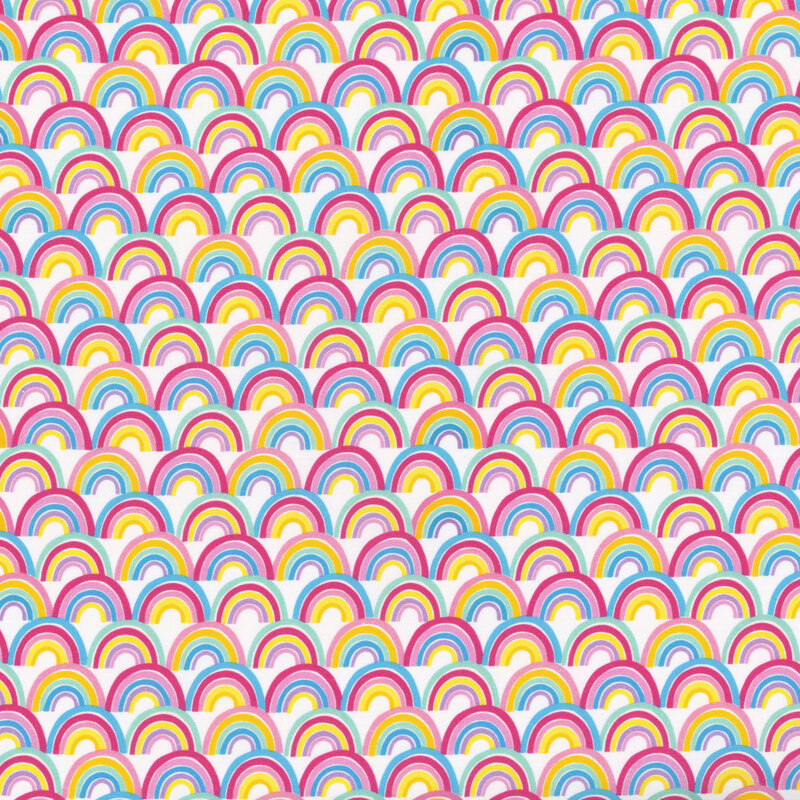 This fabric features multicolored rainbows packed on a white background. 
