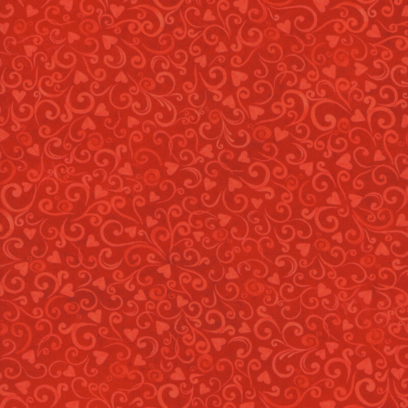 Scan of red fabric featuring tiny tonal hearts and swirls