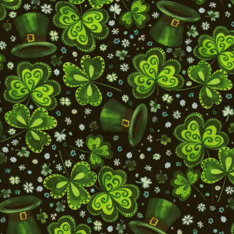 Scan of fabric featuring stylized three-leaf clovers, green top hats, and tiny tossed flowers on a black background