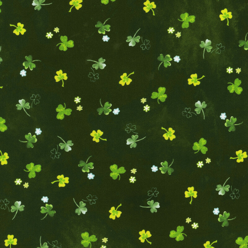 Scan of fabric featuring tossed three-leaf clovers in varying shades of green, set against a textured dark green background