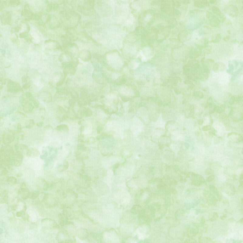 fabric with a pale green color and mottled watercolor markings