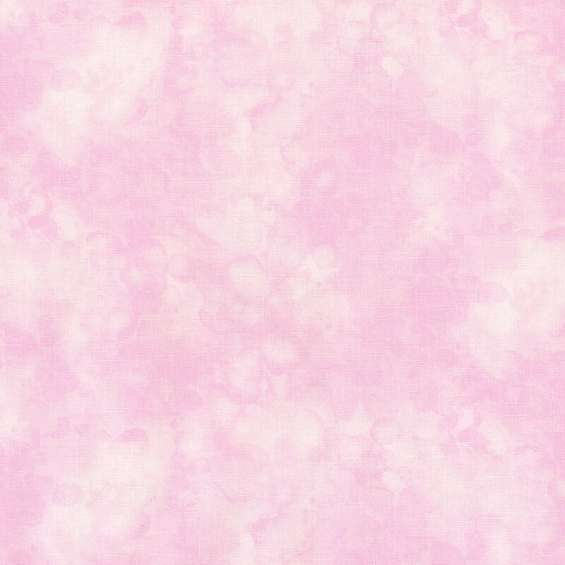 fabric with a faint pink color and mottled watercolor markings