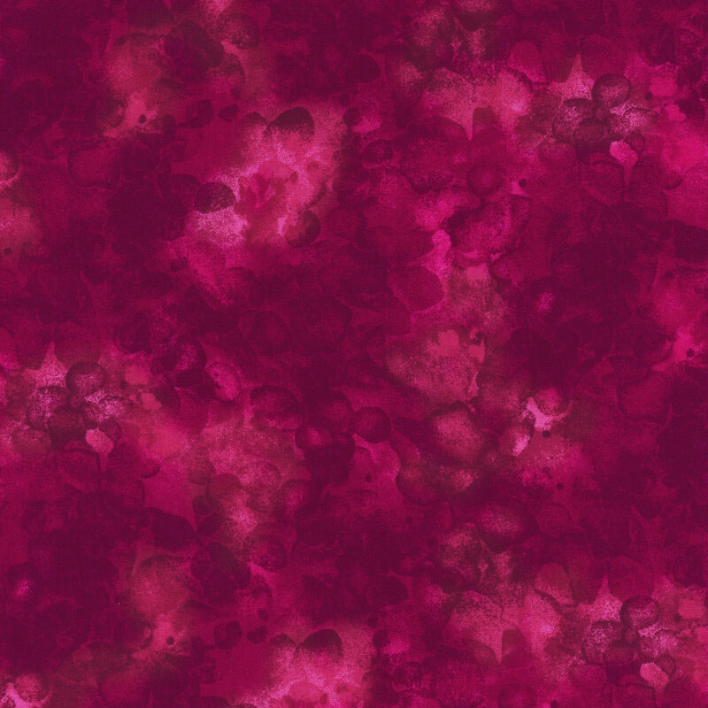 fabric with a dark fuchsia color and mottled watercolor markings