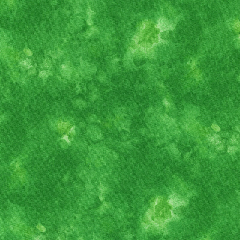 fabric with an vibrant green color and mottled watercolor markings