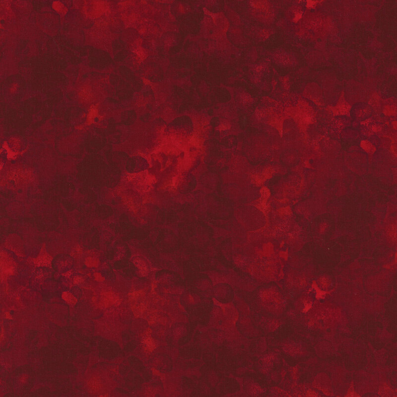 fabric with a deep red color and mottled watercolor markings