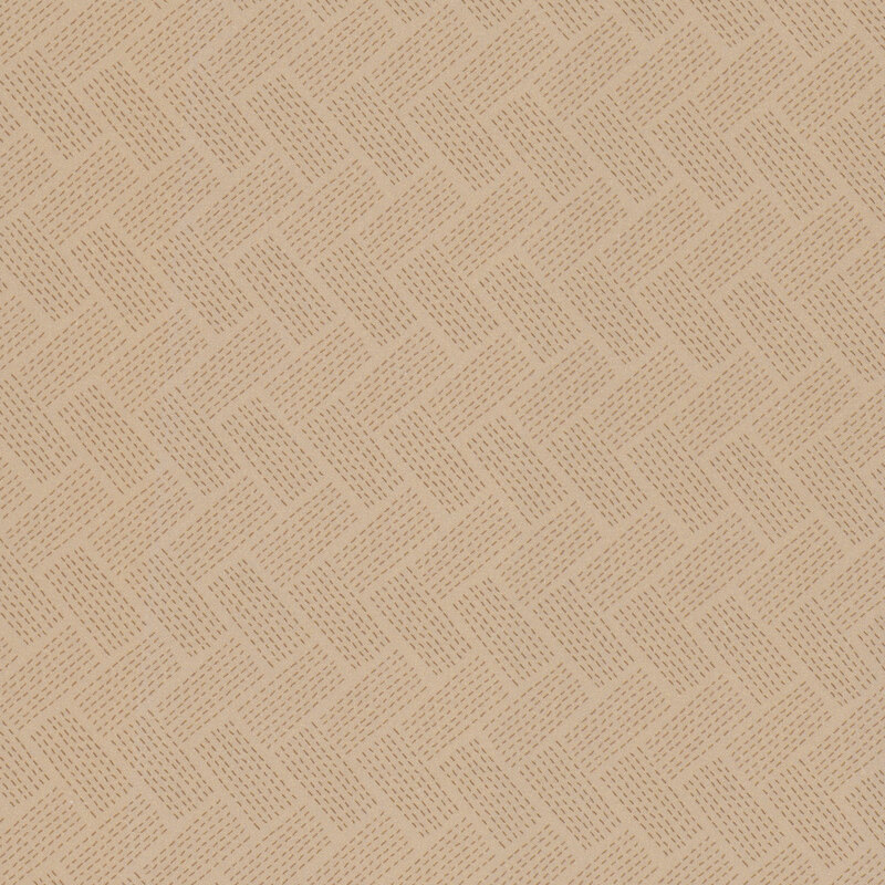 A light tan khaki fabric with a dotted woven chevron pattern