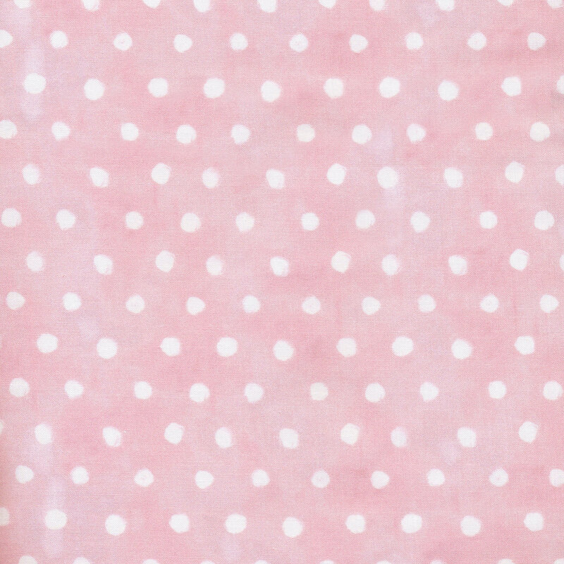 Light pink pastel fabric with small white polka dots