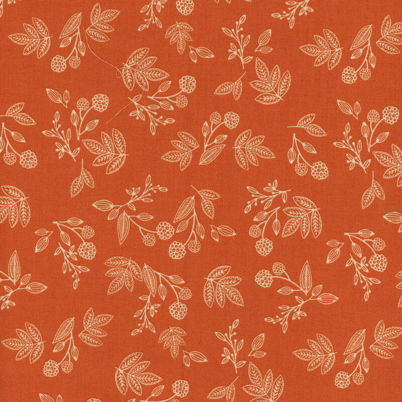 fabric featuring orange fabric with ditsy floral and leaf outlines in cream