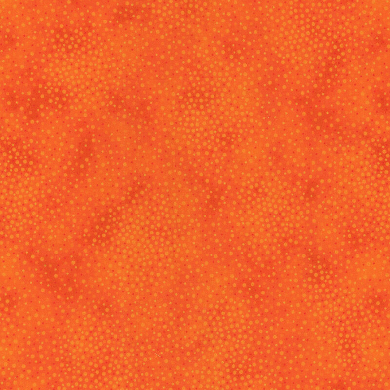 Tonal bright orange fabric with meandering dots and spots all over a mottled background
