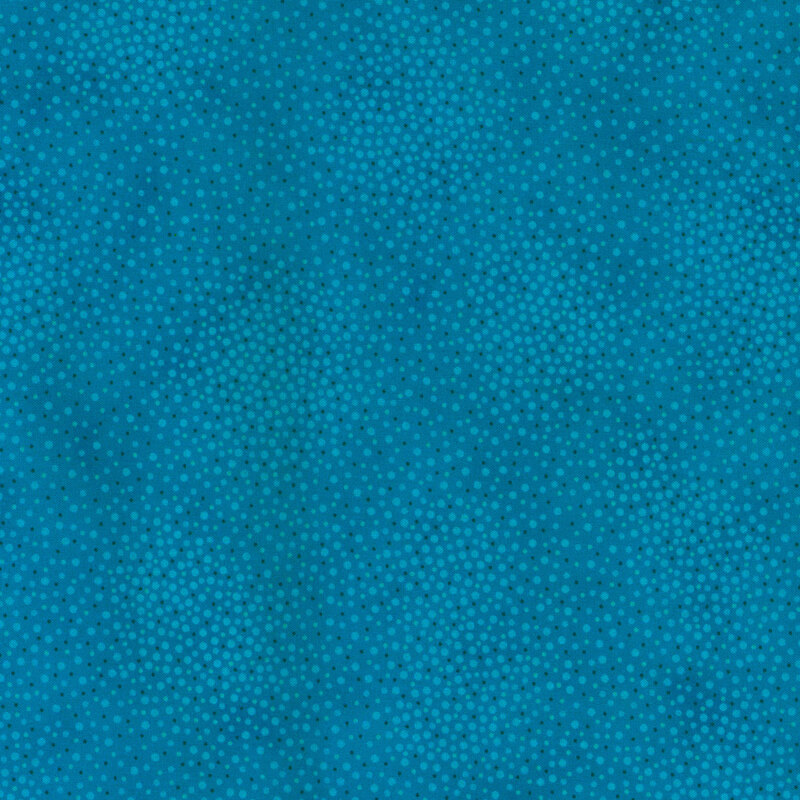Tonal medium blue fabric with meandering dots and spots all over a mottled background
