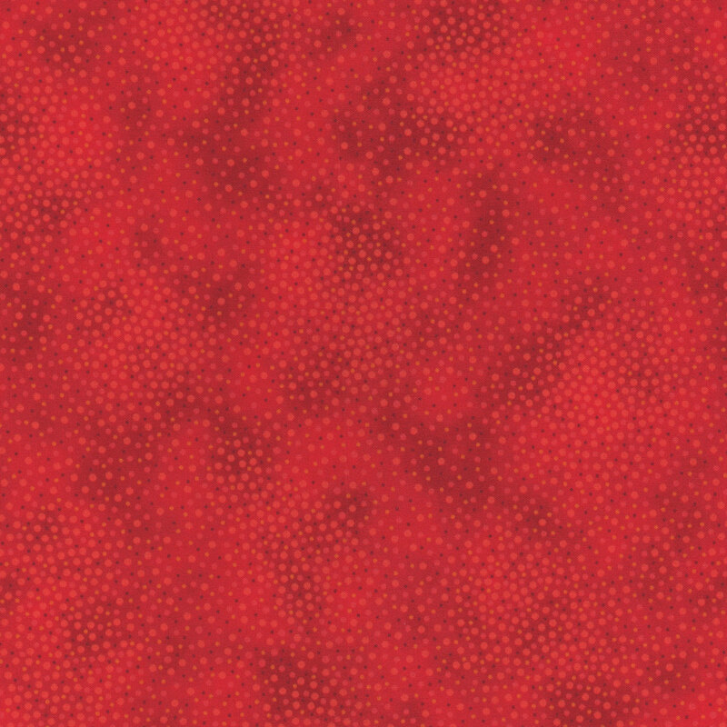 Tonal bright red fabric with meandering dots and spots all over a mottled background