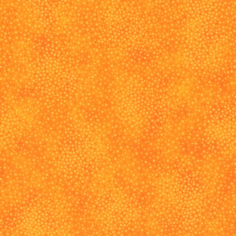 Golden yellow fabric with meandering dots and spots all over a mottled background