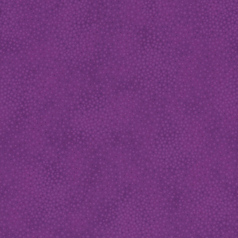 Purple fabric with meandering dots and spots all over a mottled background