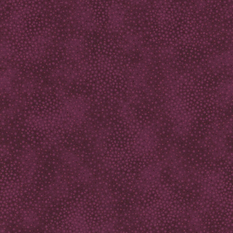 Dusty purple fabric with meandering dots and spots all over a mottled background