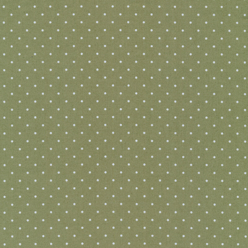 Forest green fabric with small white polka dots all over