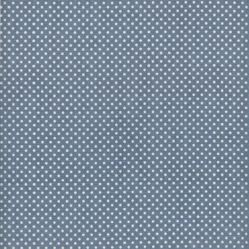 A blue gray fabric with small white polka dots all over