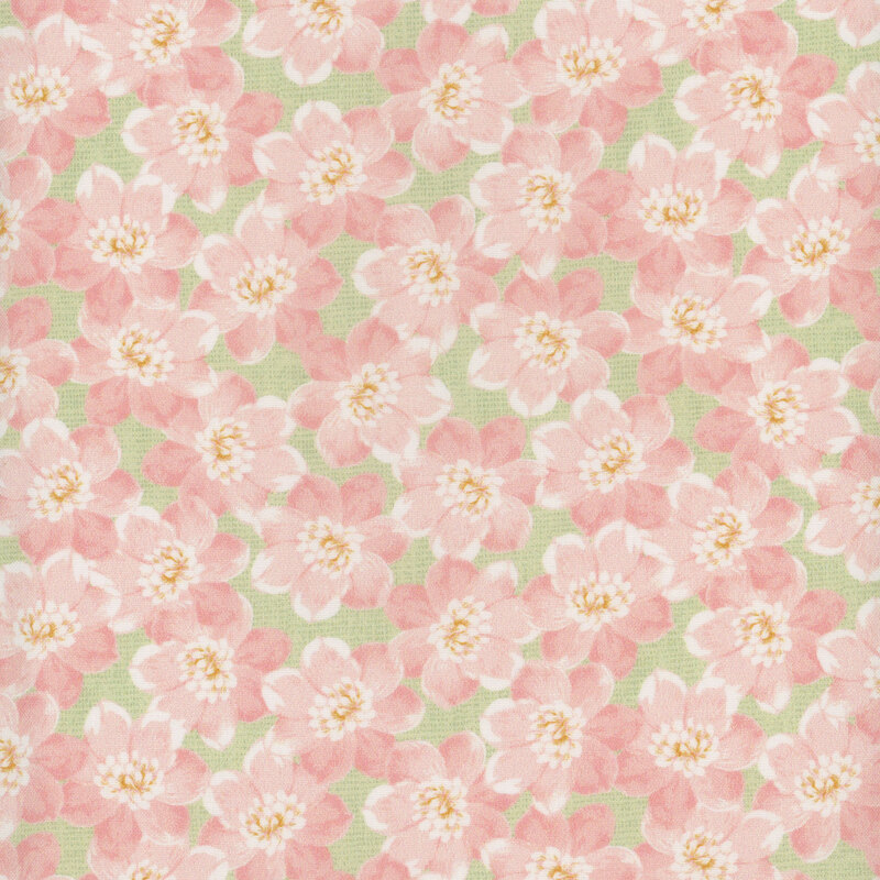A green textured fabric with packed pink florals all over