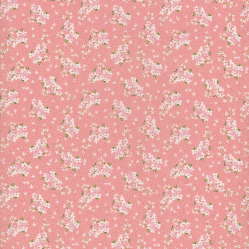 Pink fabric with small white flower petals all over and ditsy clusters of white flowers