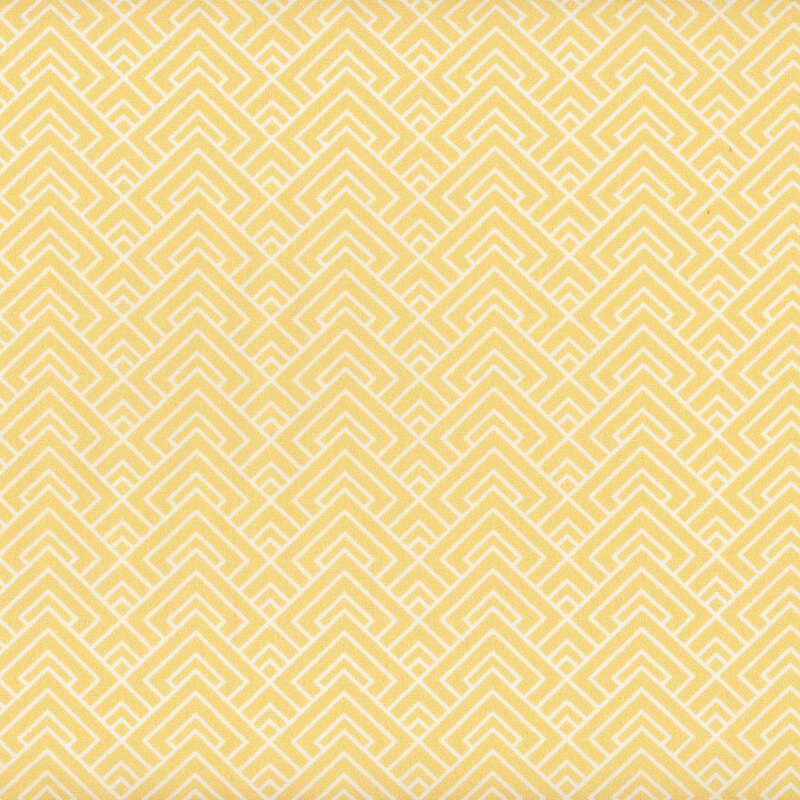 Yellow fabric with white geometric overlapping lines all over