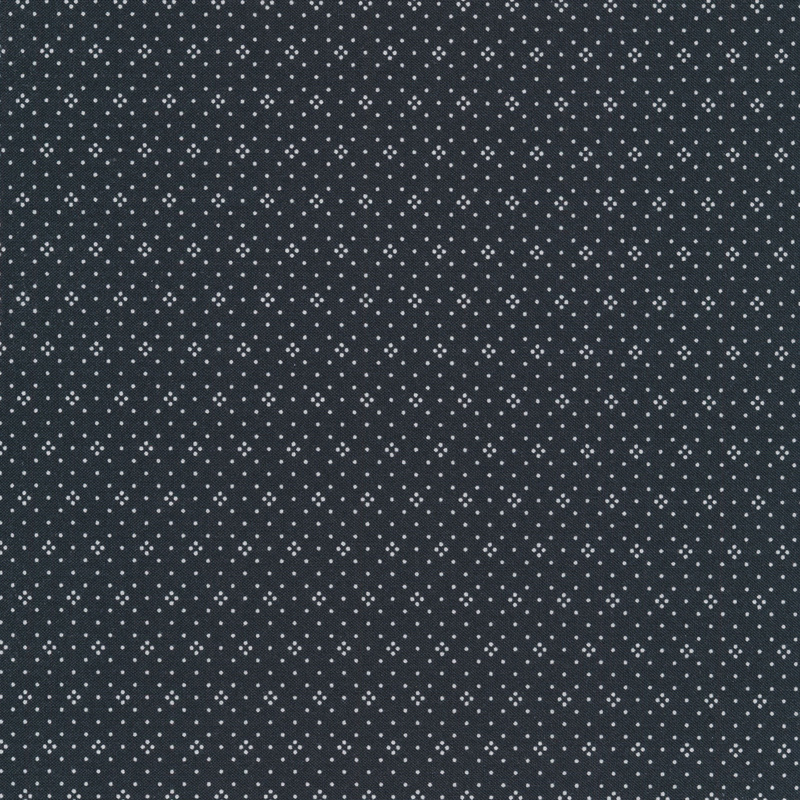 Charcoal colored fabric with small white dots all over