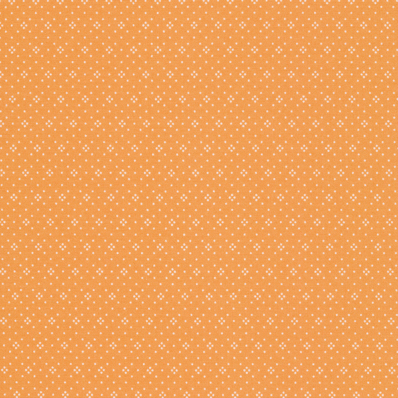 Light orange fabric with small white dots all over