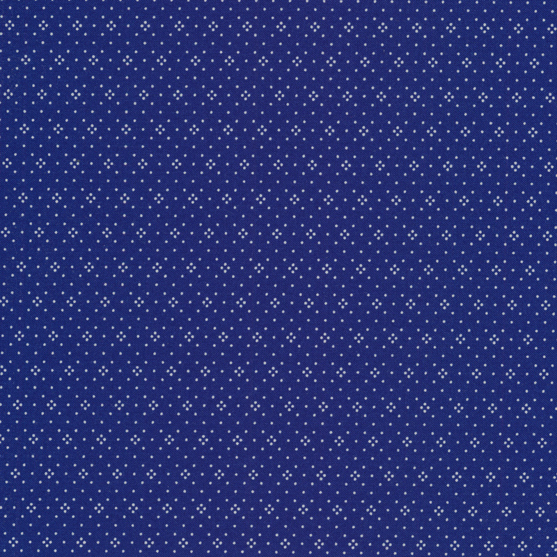 Medium blue fabric with small white dots all over