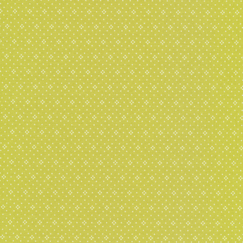 Bright green fabric with small white dots all over