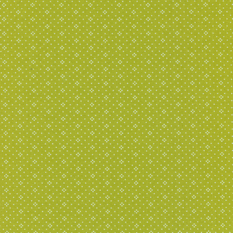 Leaf green fabric with small white dots all over