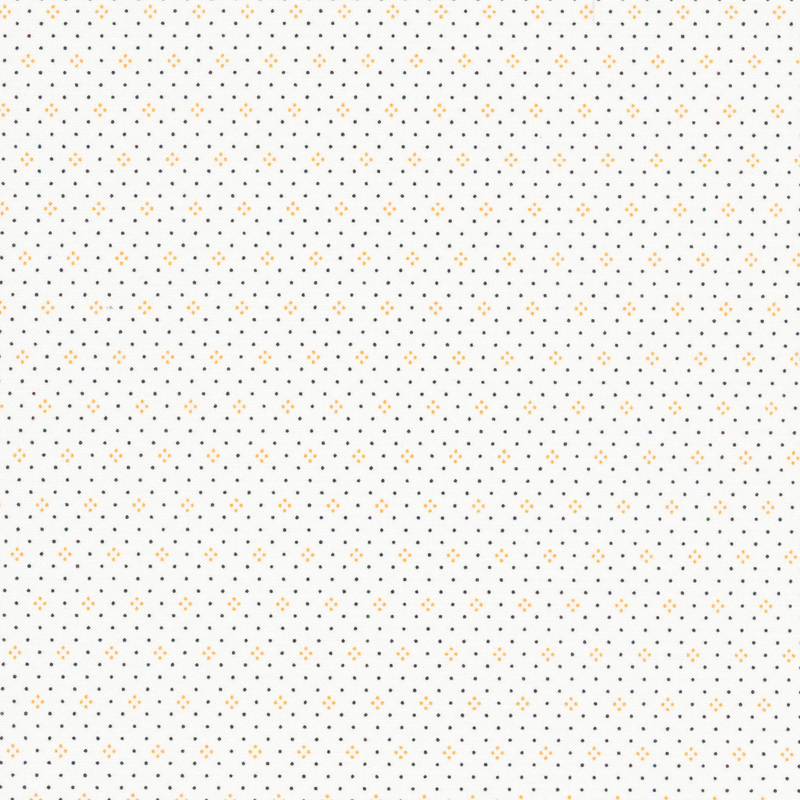 White fabric with small orange and black dots all over