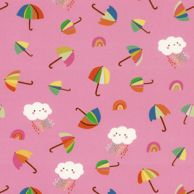 Children's fabric with ditsy smiling rainclouds, rainbows, and umbrellas on a pink background