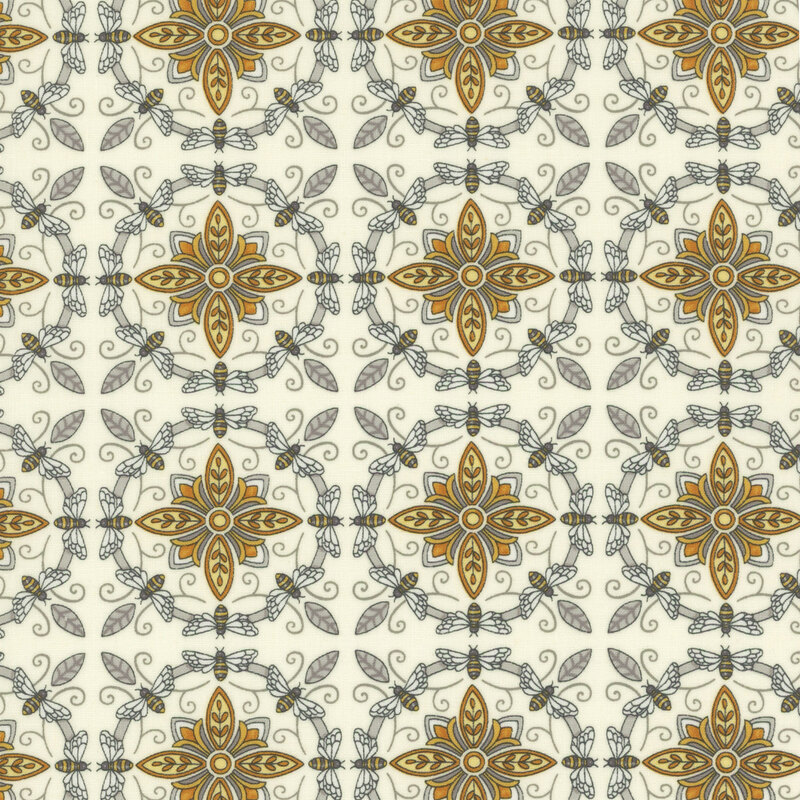 Very light cream fabric with ornate yellow and grey tiles made from bees and flowers