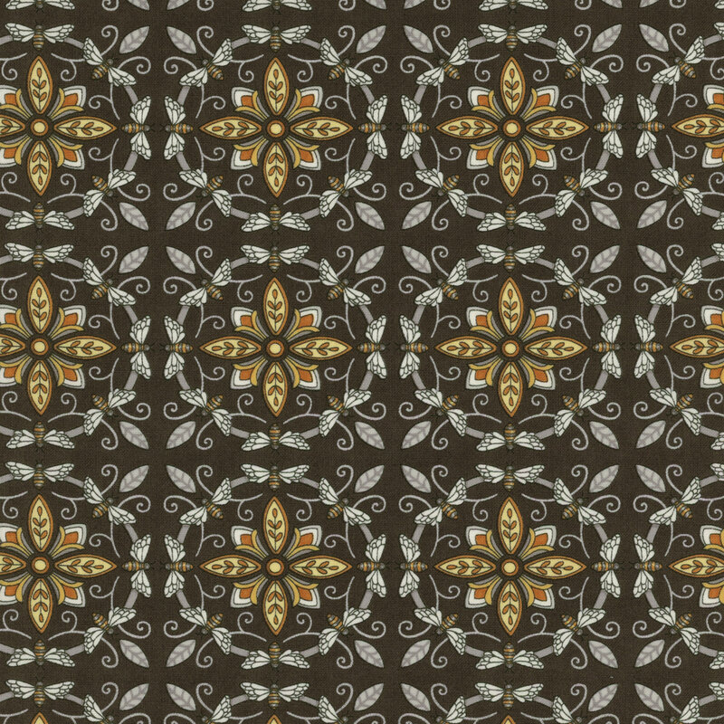 dark grey fabric with ornate yellow and grey tiles made from bees and flowers