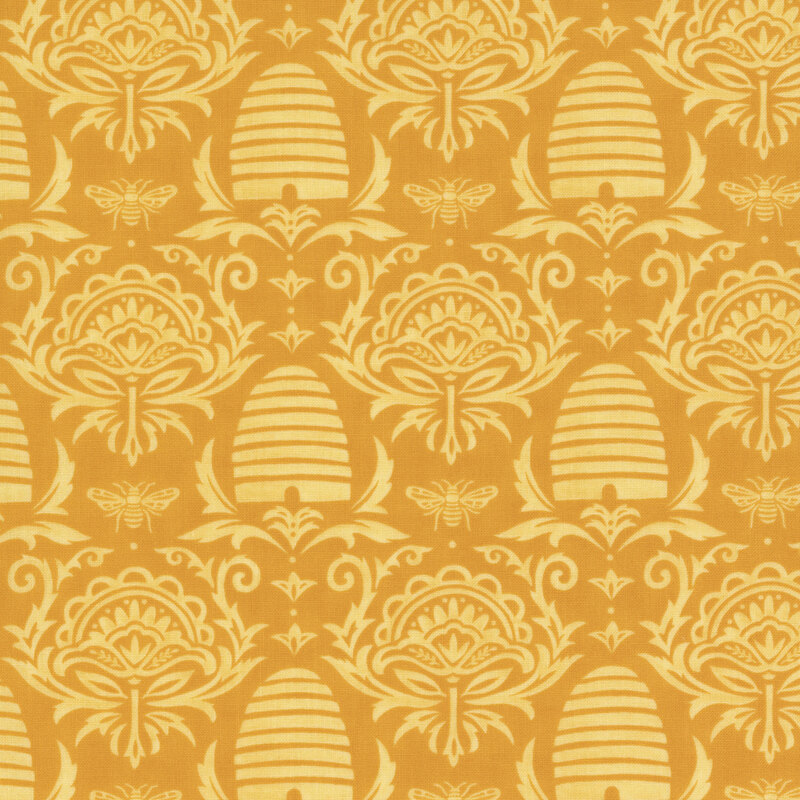 dark yellow fabric with damask, beehive, and honey bee designs on it